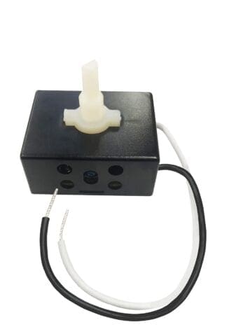 Black box with white knob and wires.